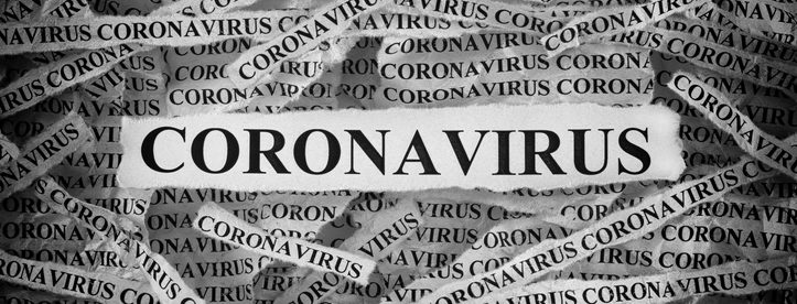 Strips of newspaper with the word Coronavirus typed on them