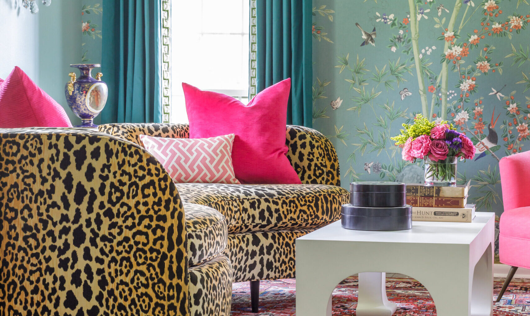 Trendy pink home decor includes hot pink and pastel pink throw pillows on this cheetah print couch.