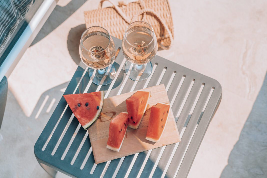 Watermelon plater with drinks on vacation at the swimming pool
