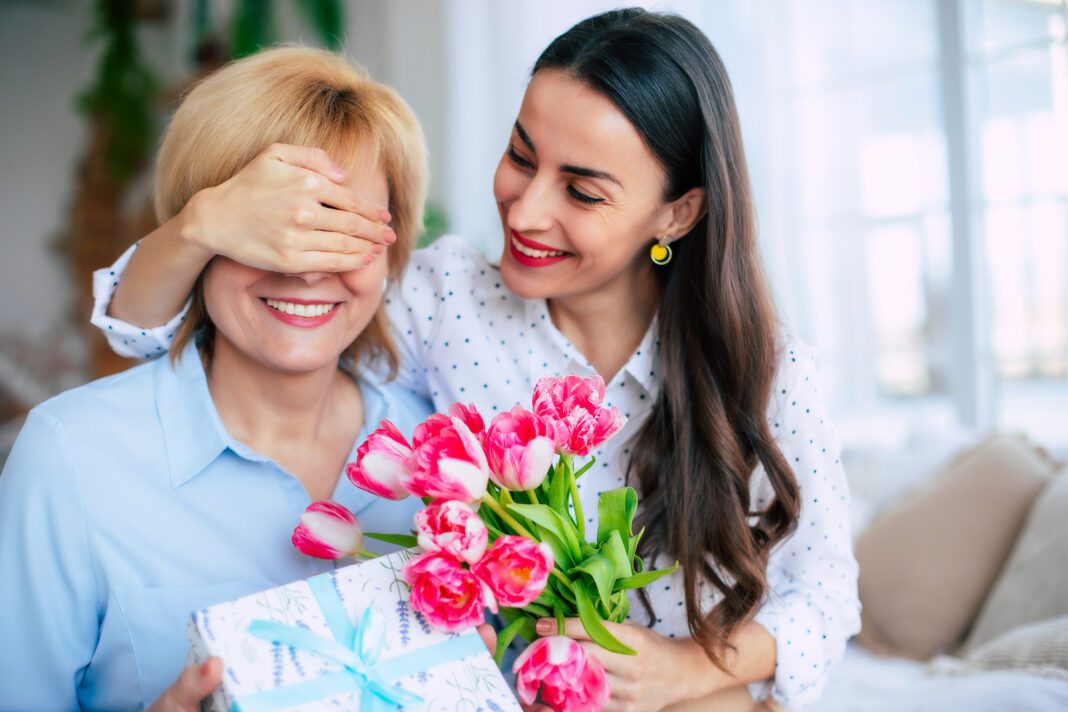 Surprise on mothers day from cute daughter. Birthday, Mothers day, women's day, retired, family, relation, motherhood.