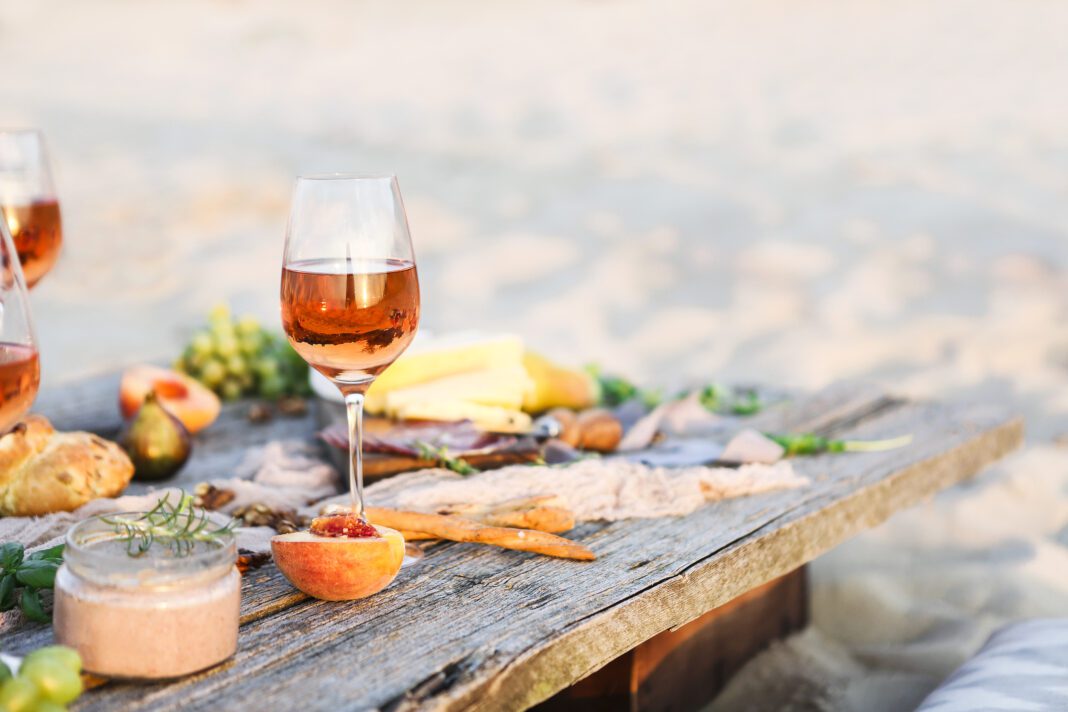 Glass of rose wine on rustic table